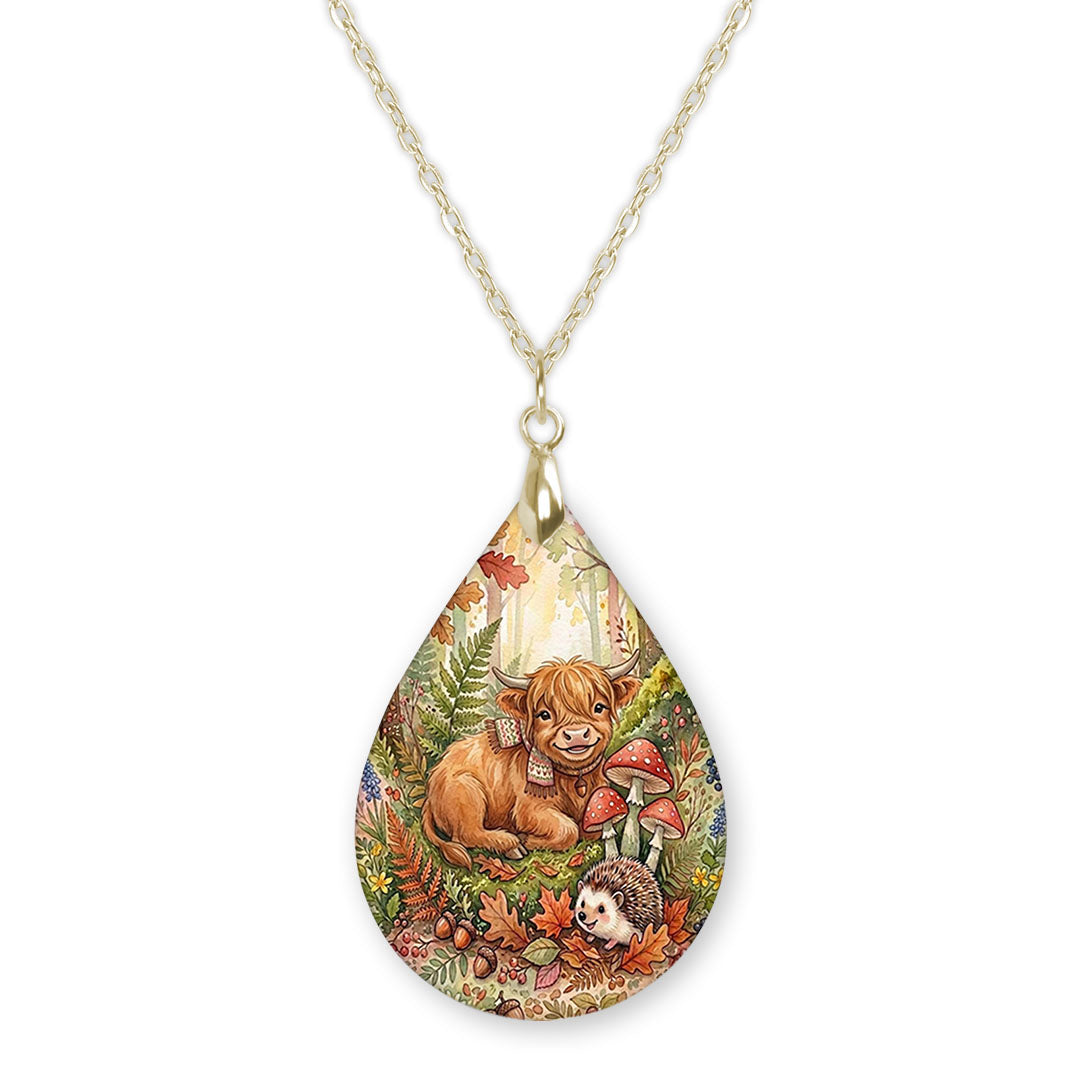 Highland Cow woodland teardrop pendant necklace on a gold-tone chain