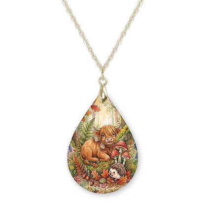 Highland Cow woodland teardrop pendant necklace on a gold-tone chain