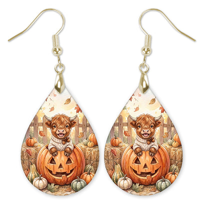 Highland Cow with a jack-o'-lantern teardrop earrings with gold-tone hooks