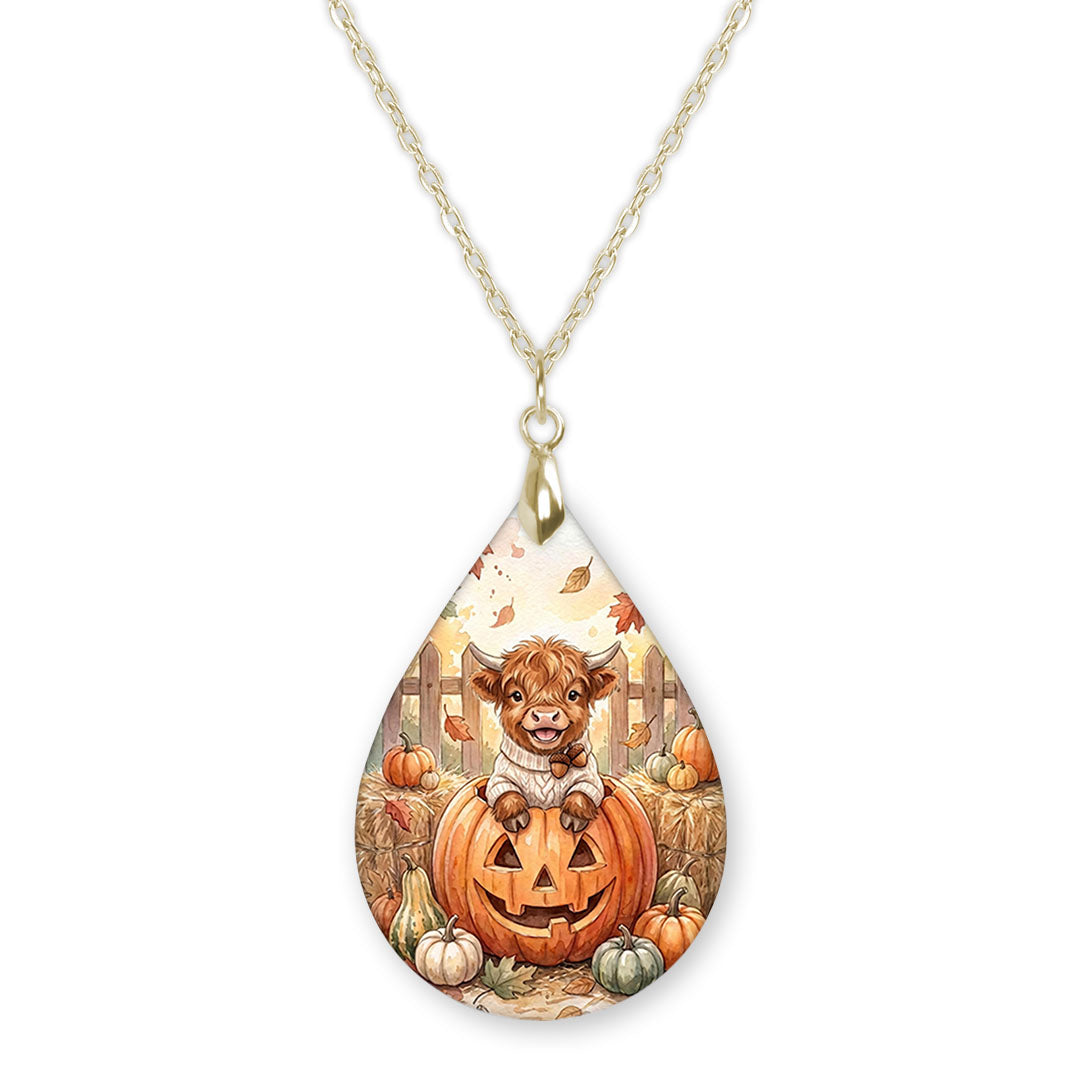 Highland Cow pumpkin teardrop pendant necklace on a gold-tone chain