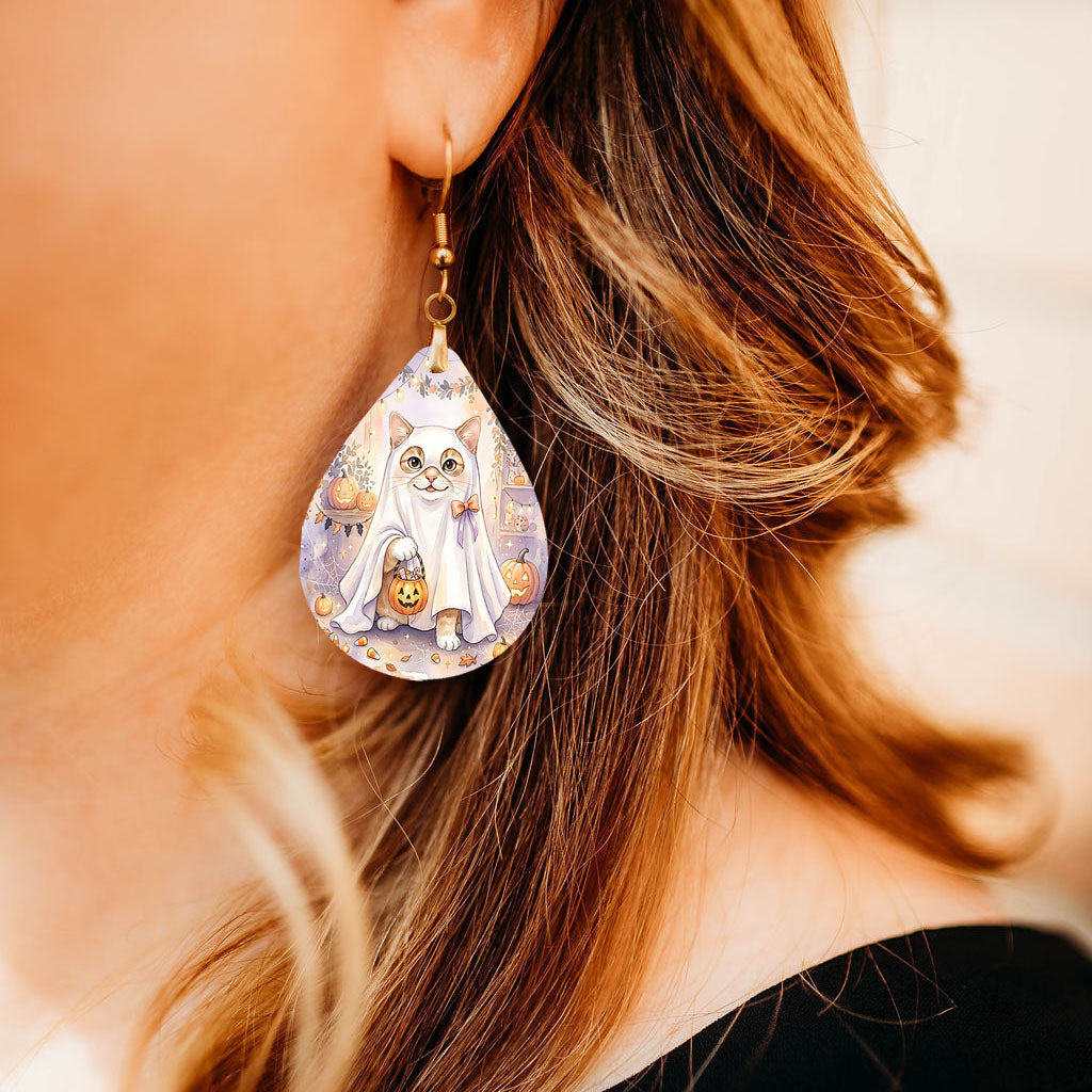 Model wearing White Cat ghost teardrop earrings