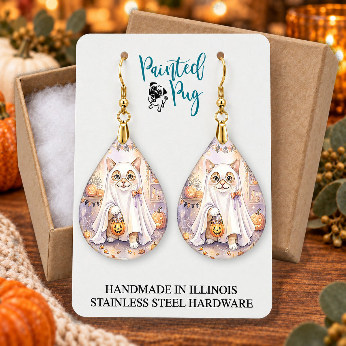 White Cat ghost teardrop earrings gift boxed on a cozy fall background