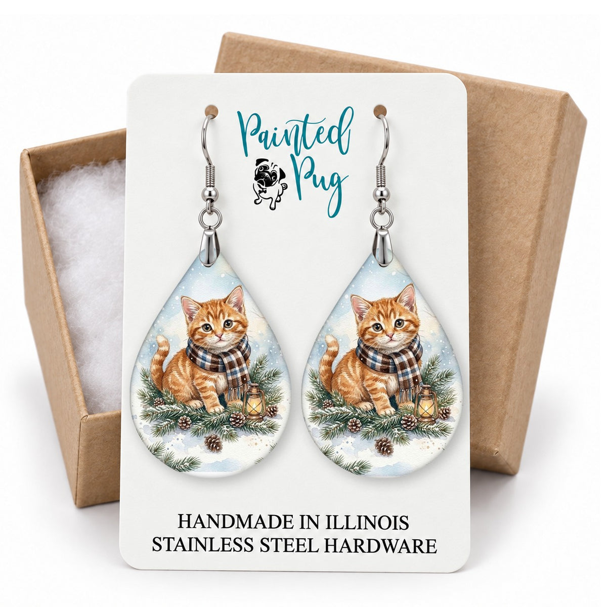 Tabby Cat Winter Woodland teardrop earrings on a gift box card
