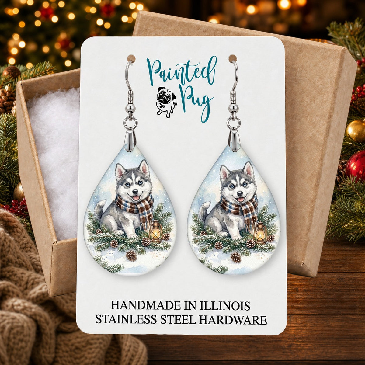 Husky Winter Woodland earrings in a gift box on a Christmas table