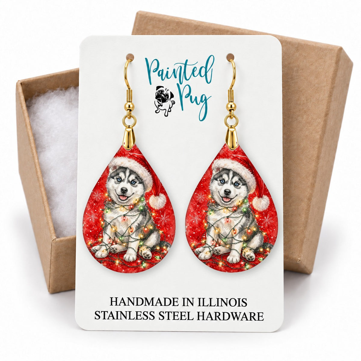 Husky Christmas Lights teardrop earrings on a gift box card