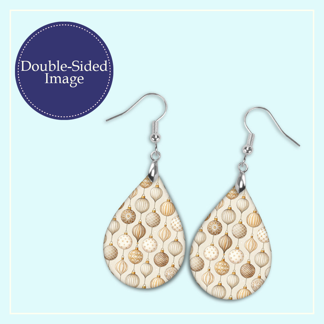 Close-up of the neutral beige Christmas ornament teardrop earrings print design