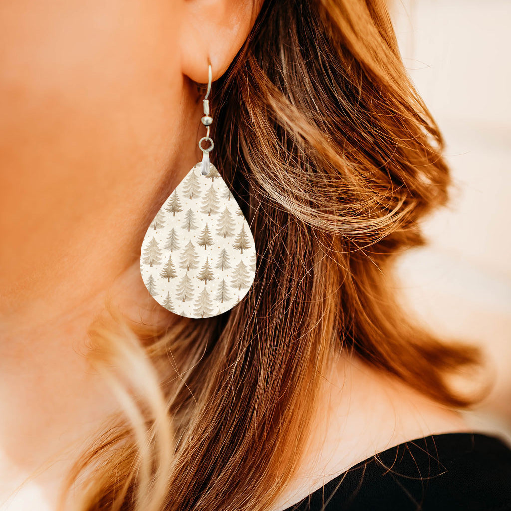 Model wearing neutral beige Christmas tree teardrop earrings