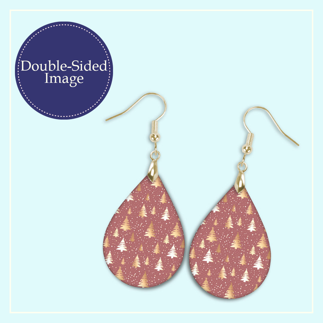 Close-up of the pink and gold Christmas tree teardrop earrings print design