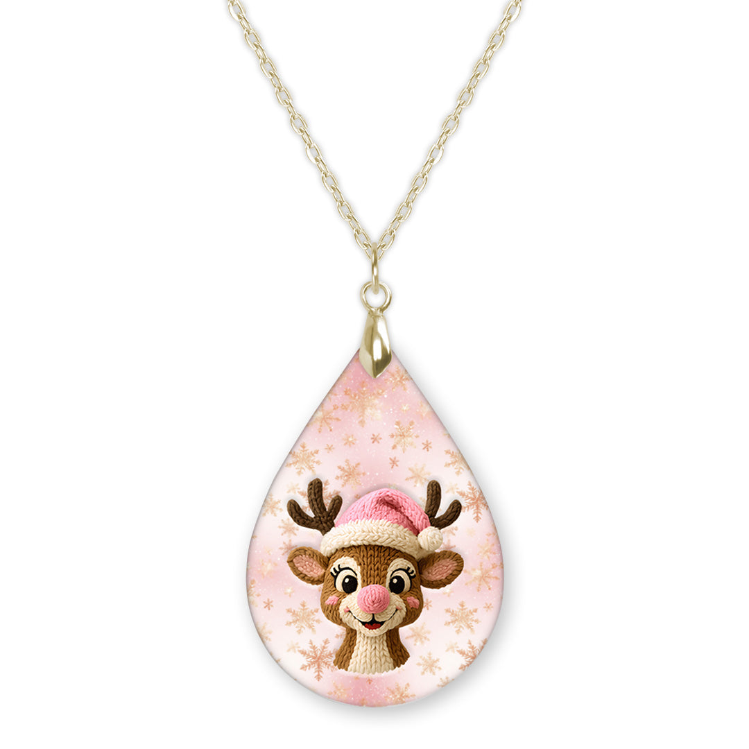 Pink reindeer Christmas teardrop pendant necklace on a gold-tone chain