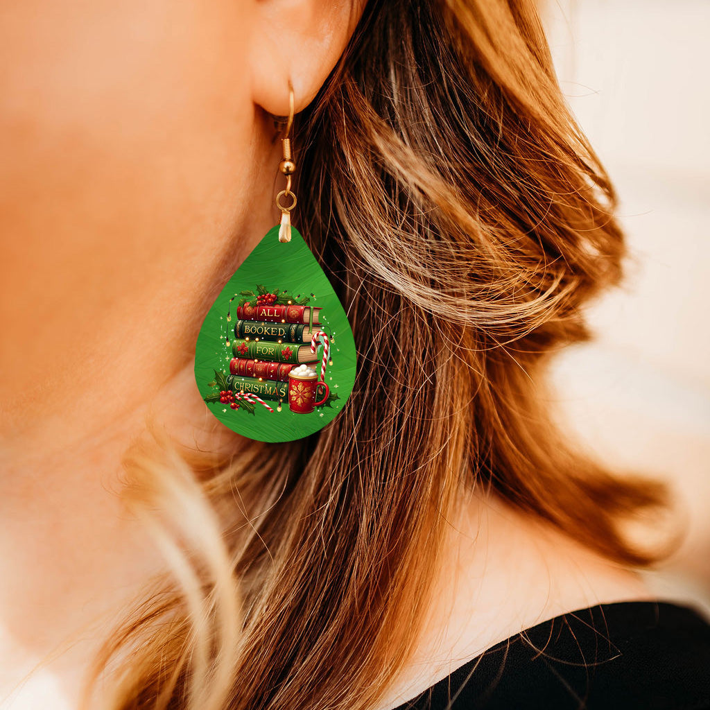 Model wearing All Booked for Christmas book stack teardrop earrings