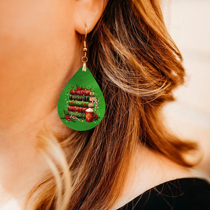 Model wearing All Booked for Christmas book stack teardrop earrings