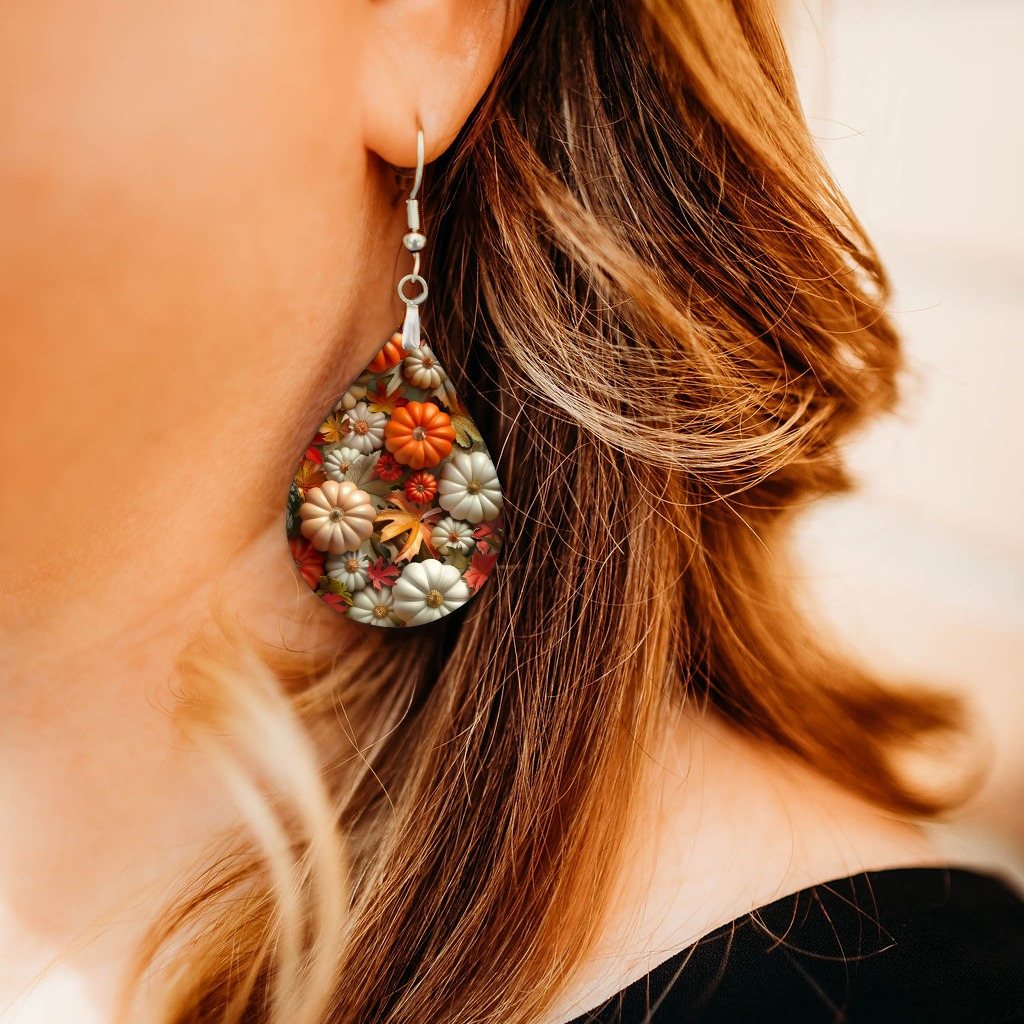 Fall Pumpkins Teardrop Earrings close-up on model