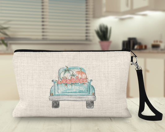 Aqua farm truck pumpkins Makeup Bag on a kitchen counter