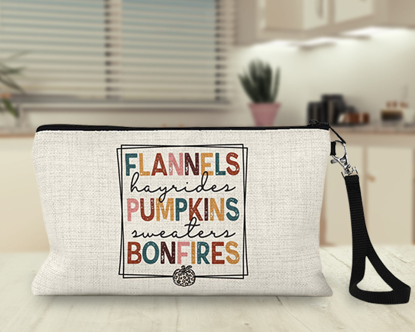 Flannels Hayrides Pumpkins Bonfires Makeup Bag on a kitchen counter