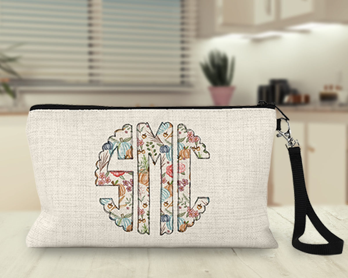 Personalized floral monogram Makeup Bag on a kitchen counter