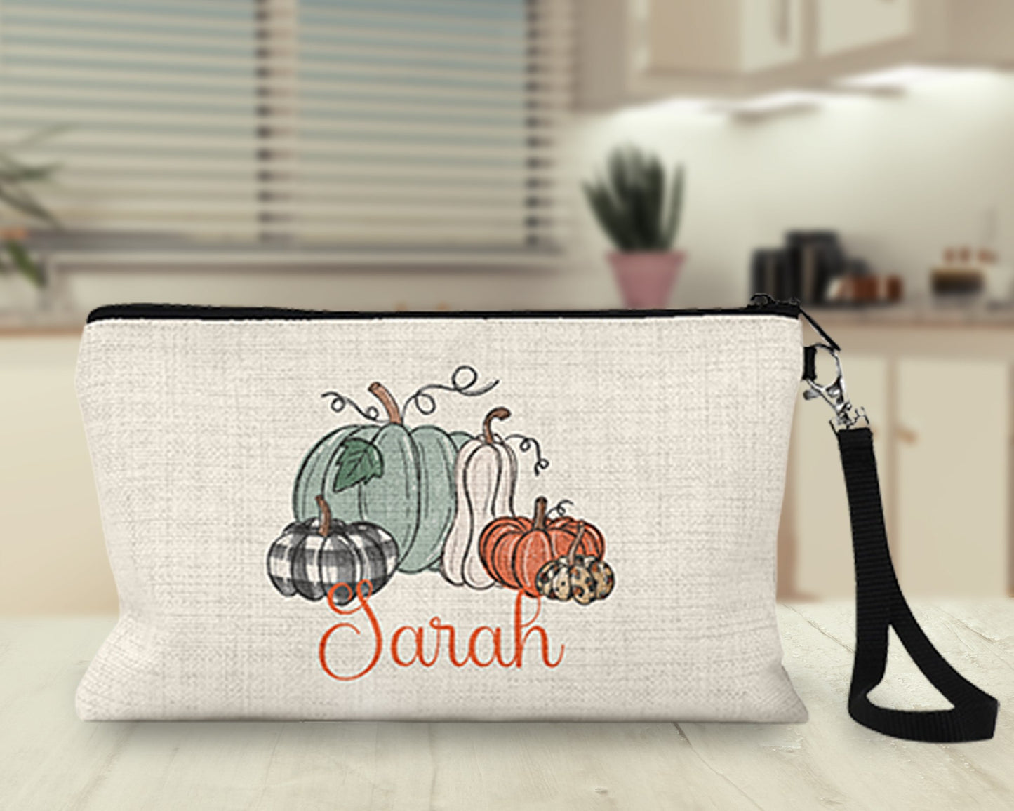 Personalized pumpkin patch Makeup Bag on a kitchen counter