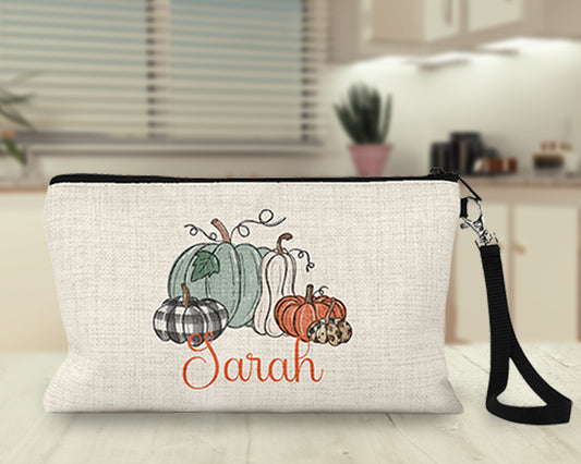 Personalized pumpkin patch Makeup Bag on a kitchen counter