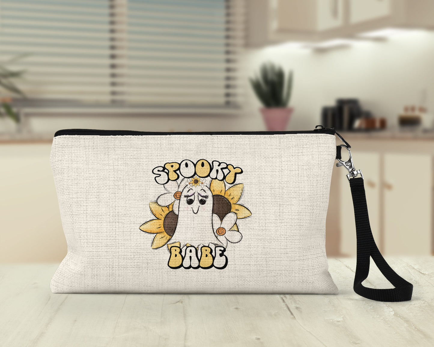 Spooky Babe retro ghost Makeup Bag on a desk