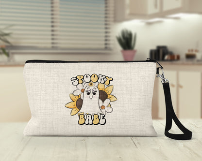 Spooky Babe retro ghost Makeup Bag on a desk