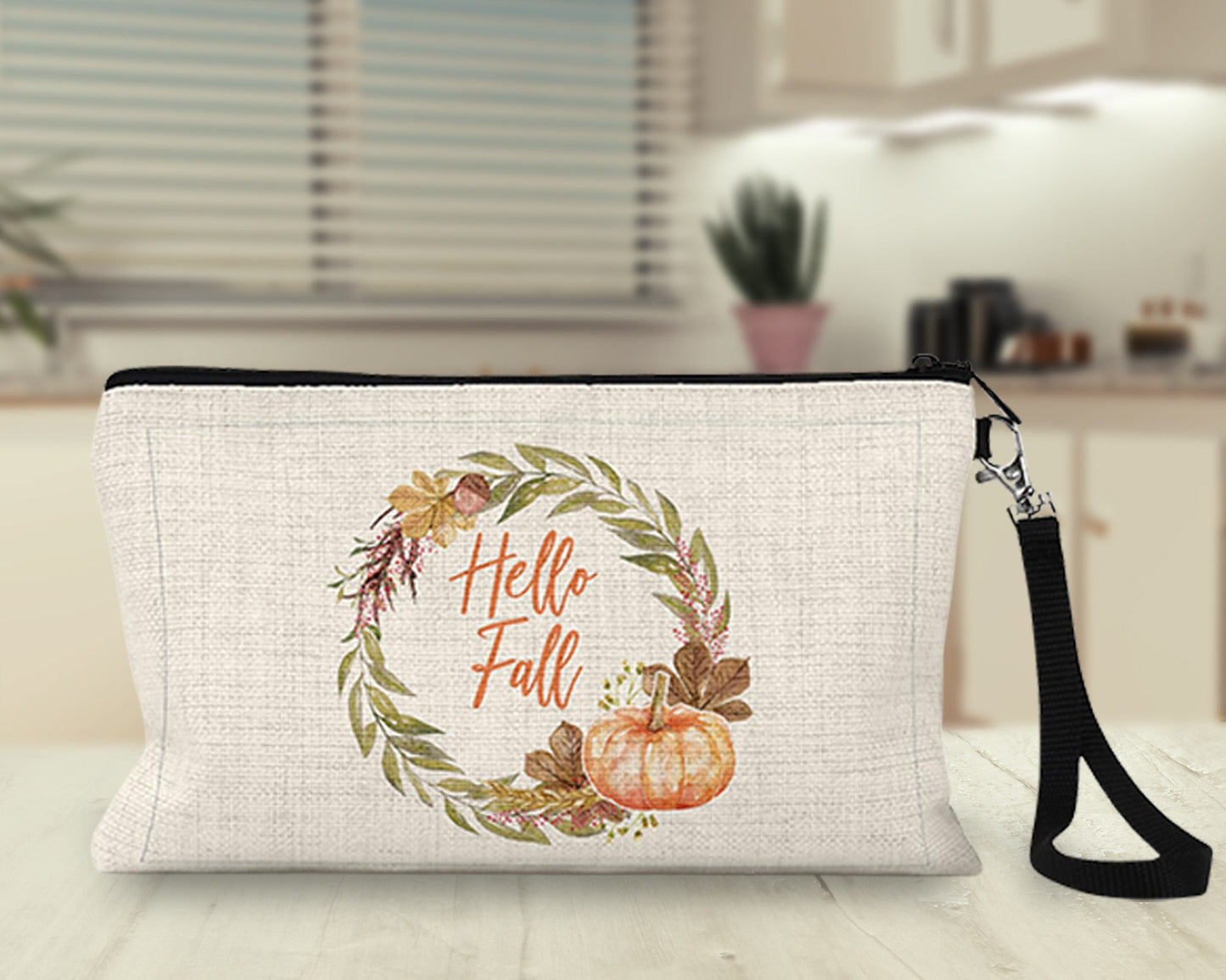 Hello Fall floral wreath Makeup Bag on a kitchen counter
