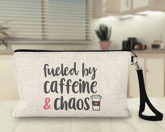 Fueled by Caffeine and Chaos Makeup Bag on a desk