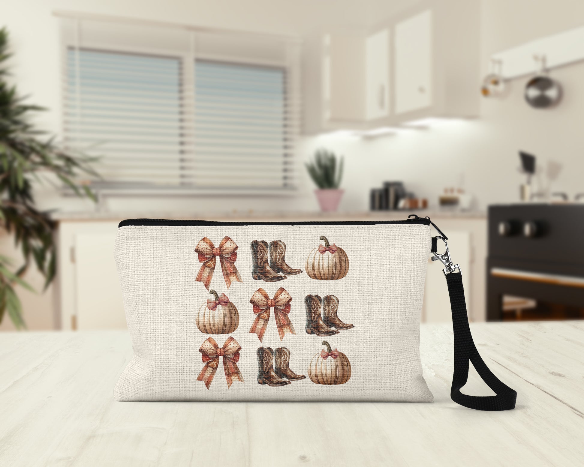 Bows Boots and Pumpkins Makeup Bag on a kitchen counter