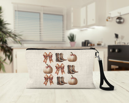 Bows Boots and Pumpkins Makeup Bag on a kitchen counter
