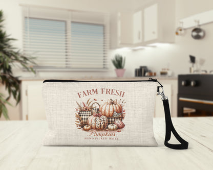 Farm Fresh Pumpkins Makeup Bag on a kitchen counter