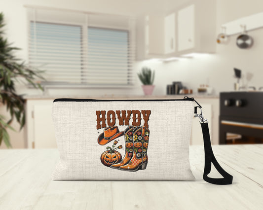 Howdy Cowboy Boots Makeup Bag on a kitchen counter