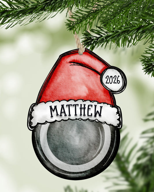 Personalized hockey Christmas ornament hanging on a Christmas tree - The Painted Pug