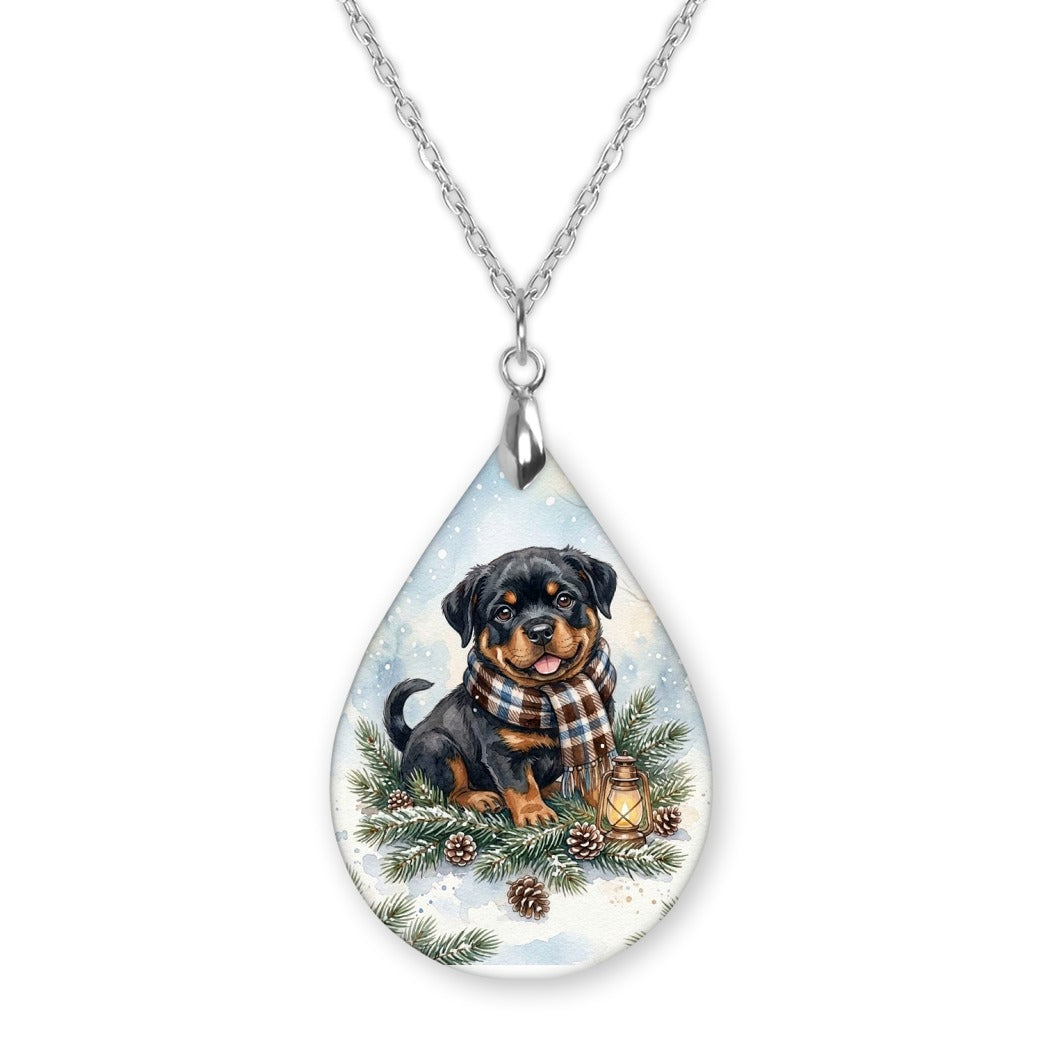 Rottweiler Winter Woodland teardrop pendant necklace on a silver-tone chain