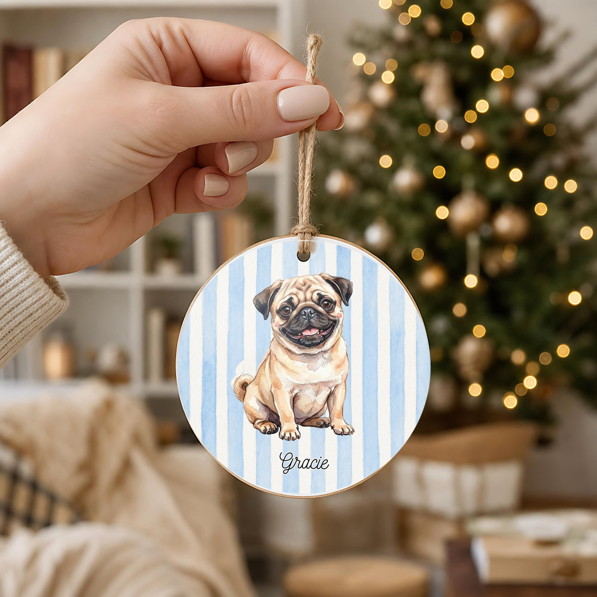 Personalized Fawn Pug ornament held in hand to show its 3 inch size