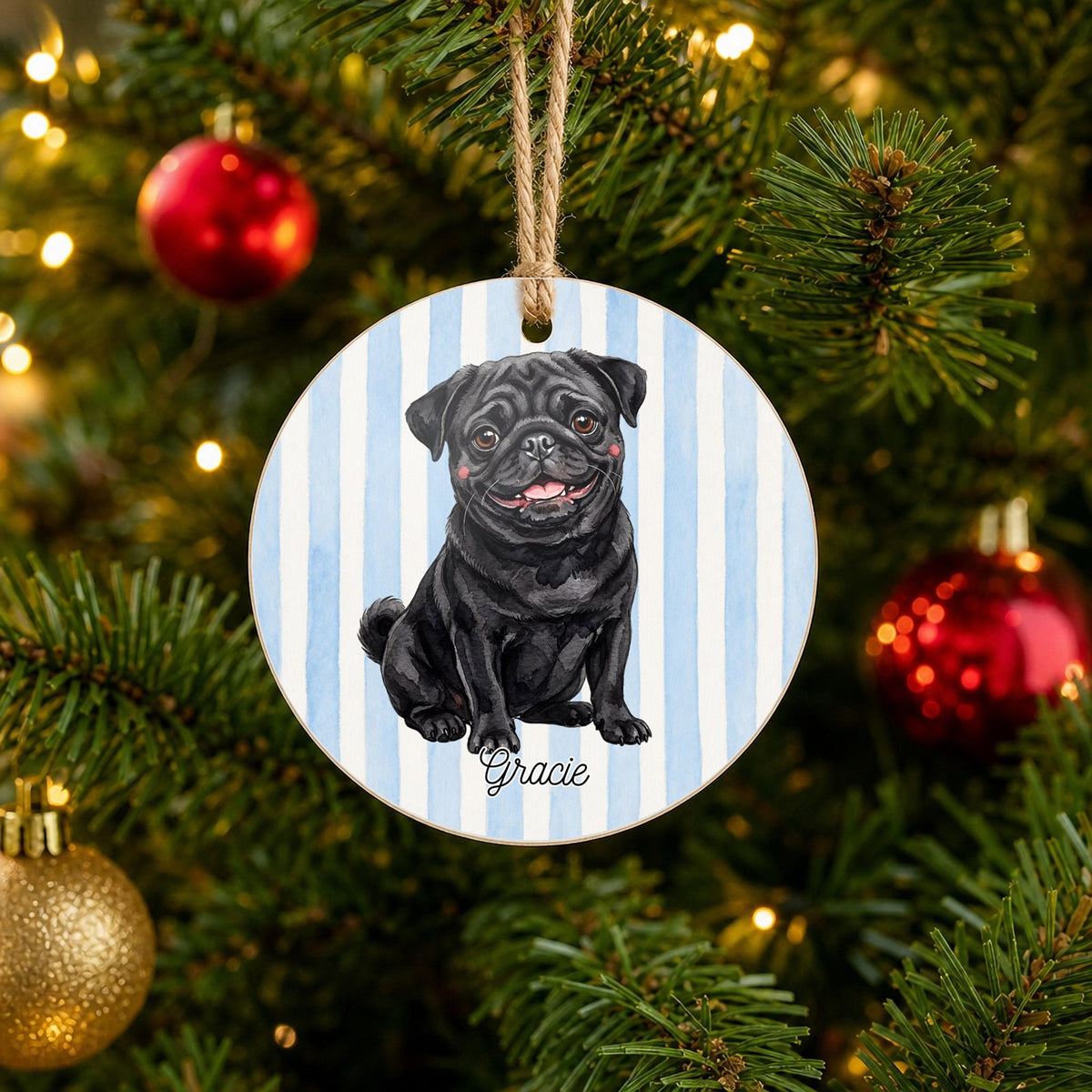 Personalized Black Pug Christmas ornament with custom name hanging on a Christmas tree