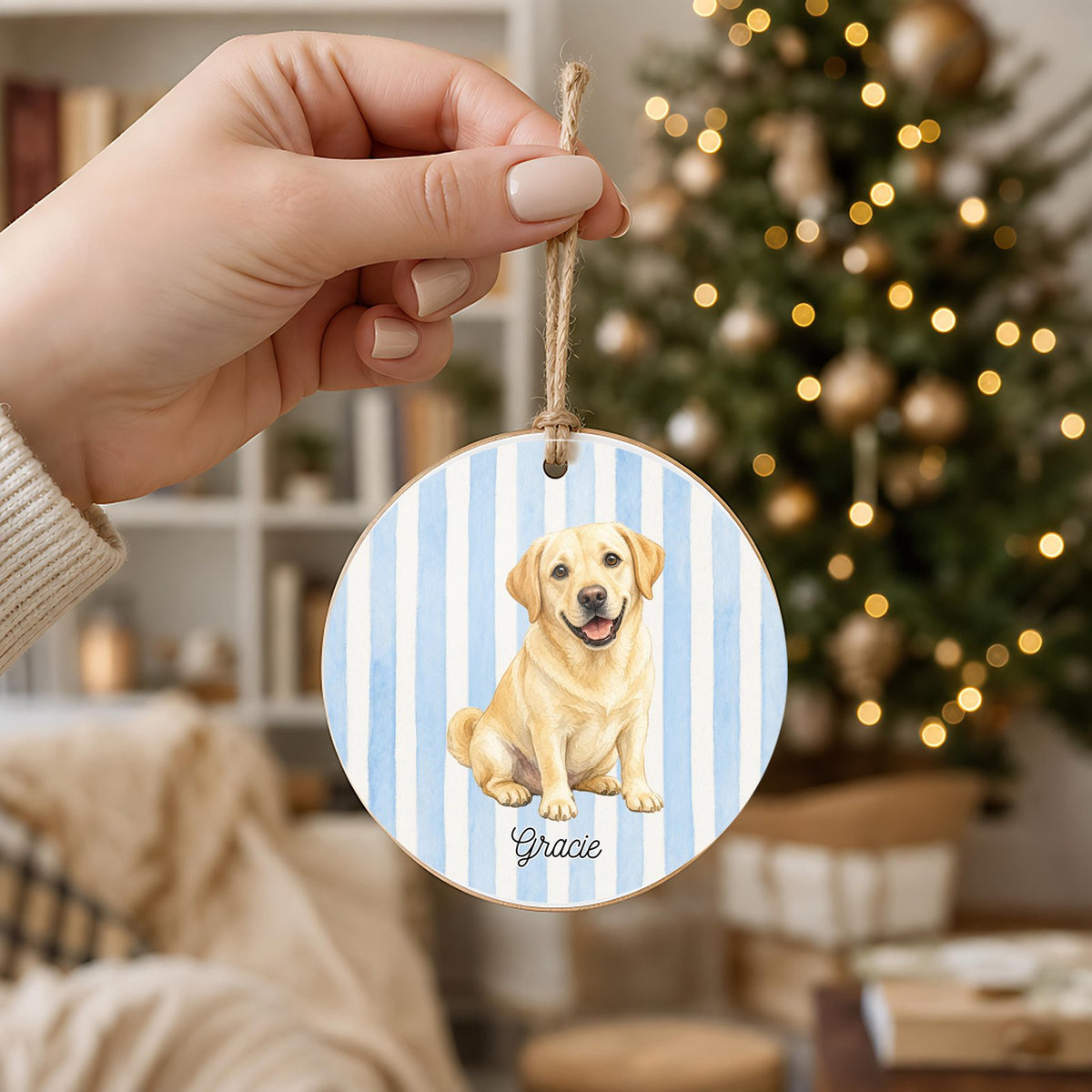 Personalized Yellow Lab ornament held in hand to show its 3 inch size