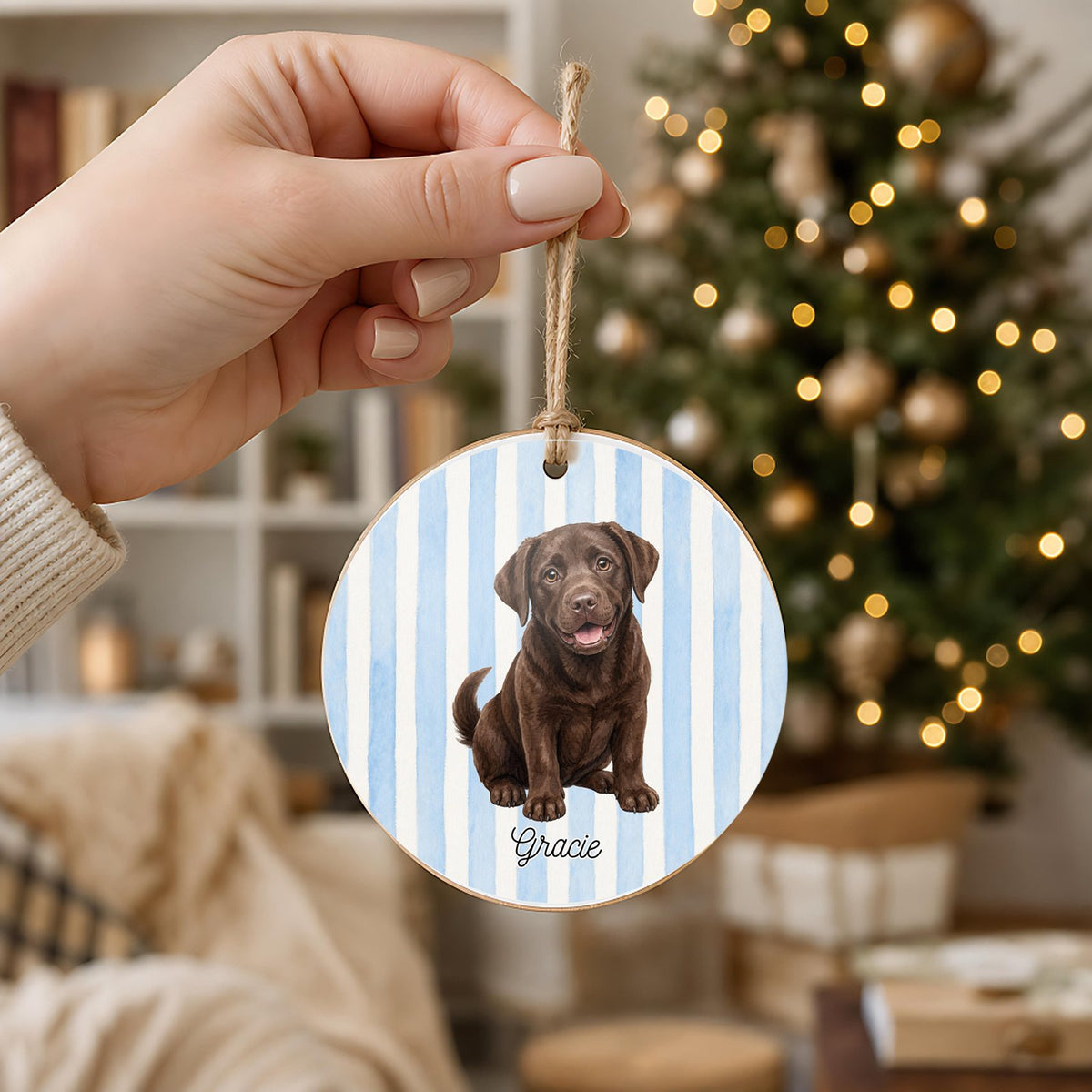Personalized Chocolate Lab ornament held in hand to show its 3 inch size
