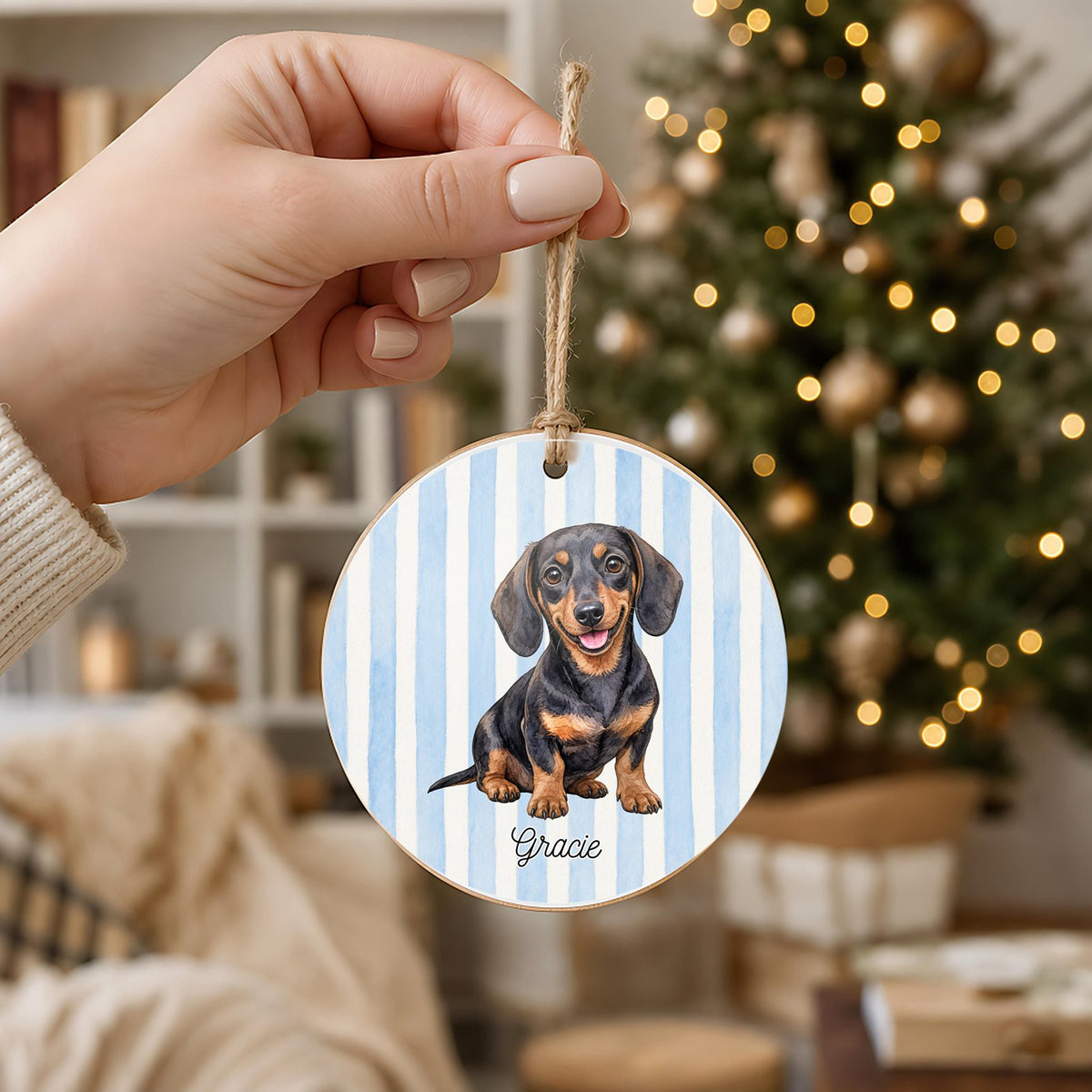 Personalized Dachshund ornament held in hand to show its 3 inch size