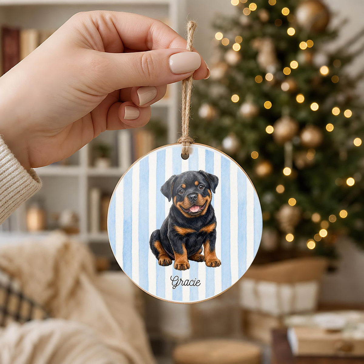 Personalized Rottweiler ornament held in hand to show its 3 inch size