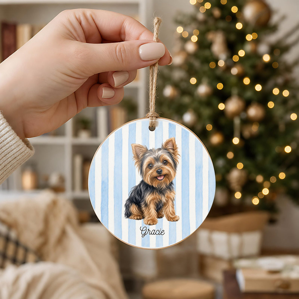 Personalized Yorkie ornament held in hand to show its 3 inch size