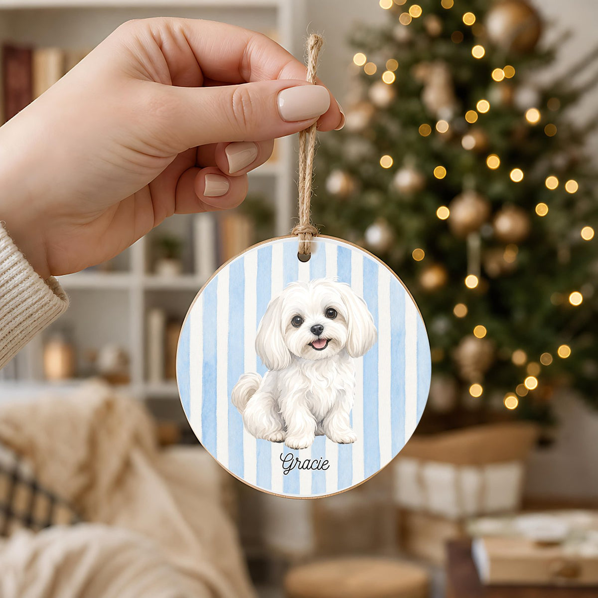 Personalized Maltese ornament held in hand to show its 3 inch size