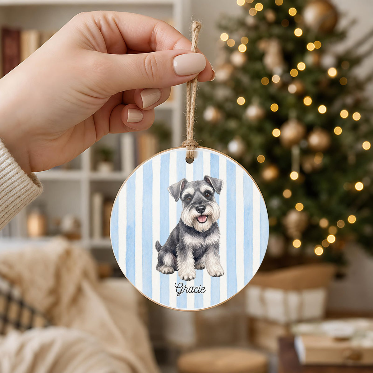Personalized Schnauzer ornament held in hand to show its 3 inch size