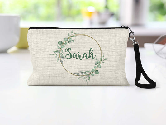 Personalized greenery wreath Makeup Bag on a counter
