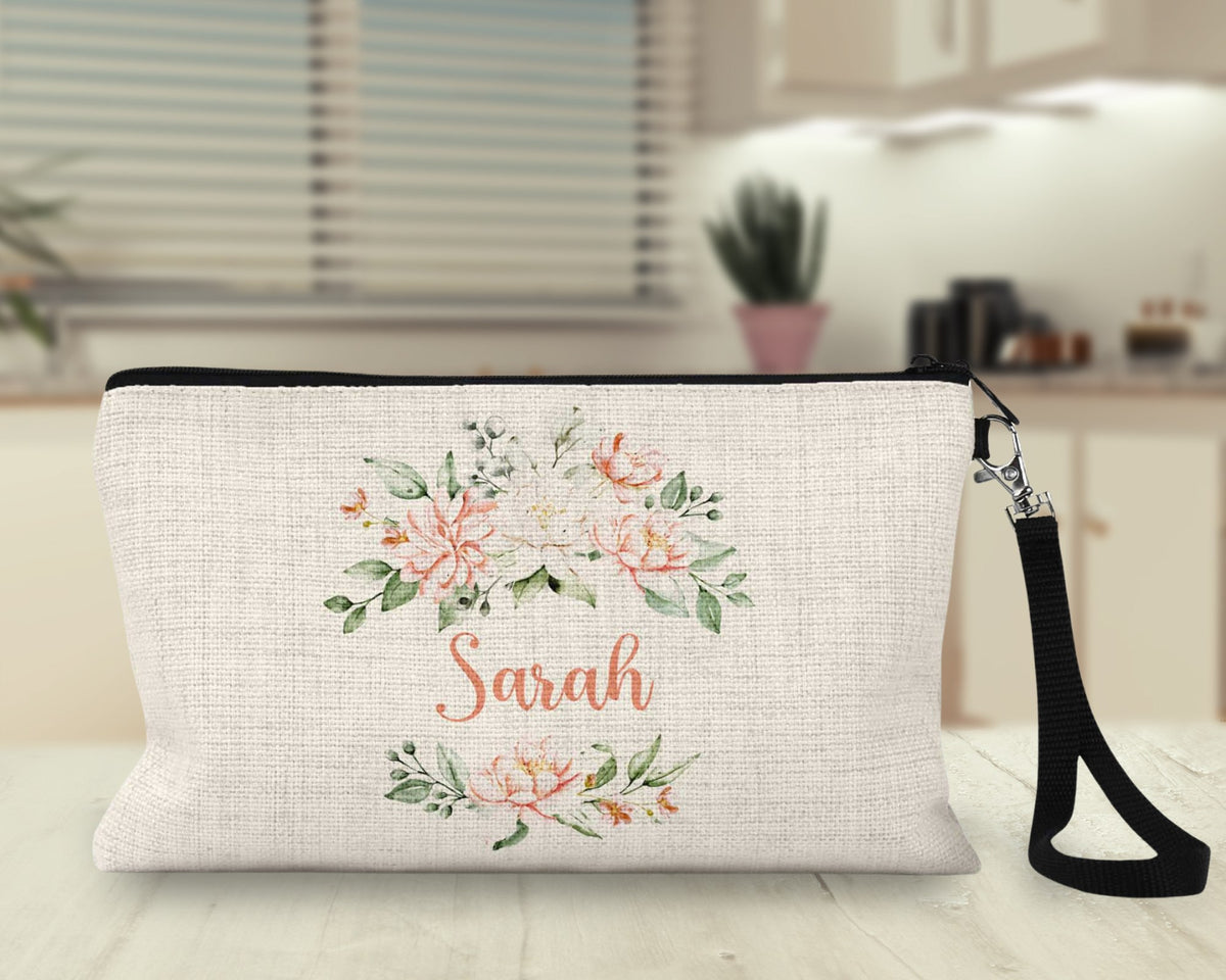 Personalized peach floral Makeup Bag on a kitchen counter