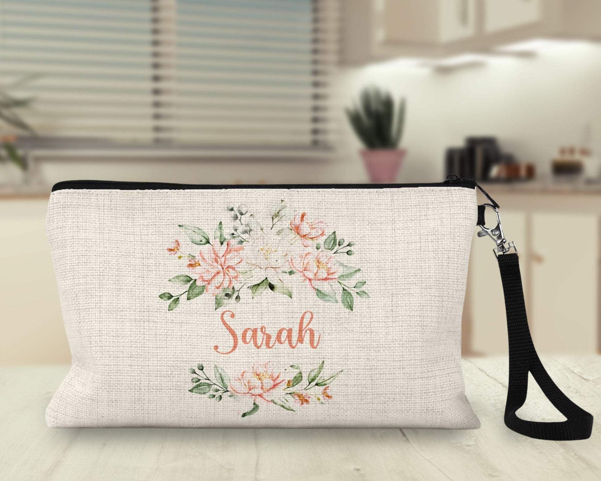 Personalized peach floral Makeup Bag on a kitchen counter