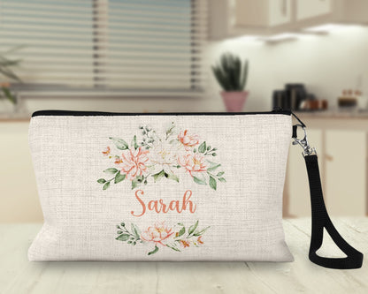 Personalized peach floral Makeup Bag on a kitchen counter