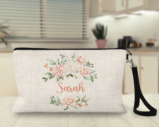 Personalized peach floral Makeup Bag on a kitchen counter