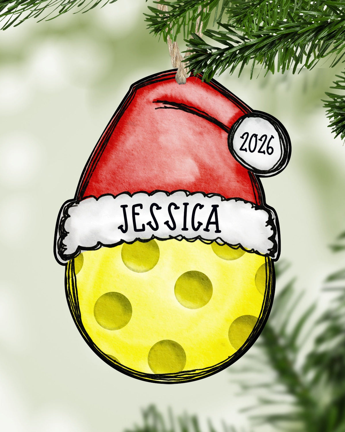 Personalized pickleball Christmas ornament hanging on a Christmas tree - The Painted Pug