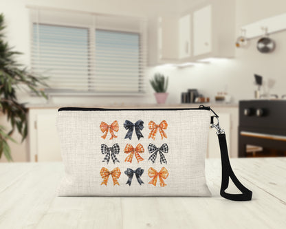 Orange and Black Bows Makeup Bag on a kitchen counter