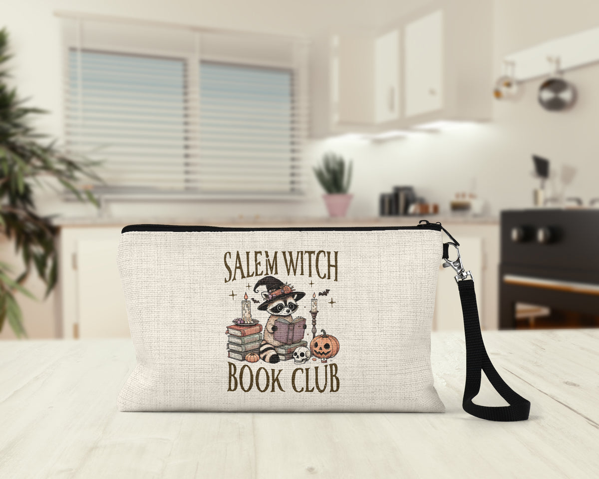 Salem Witch Book Club Makeup Bag on a kitchen counter