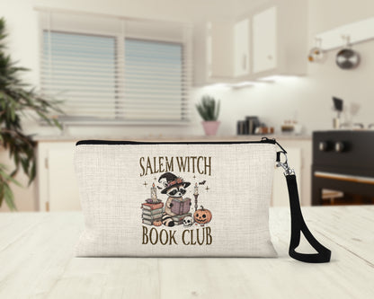 Salem Witch Book Club Makeup Bag on a kitchen counter