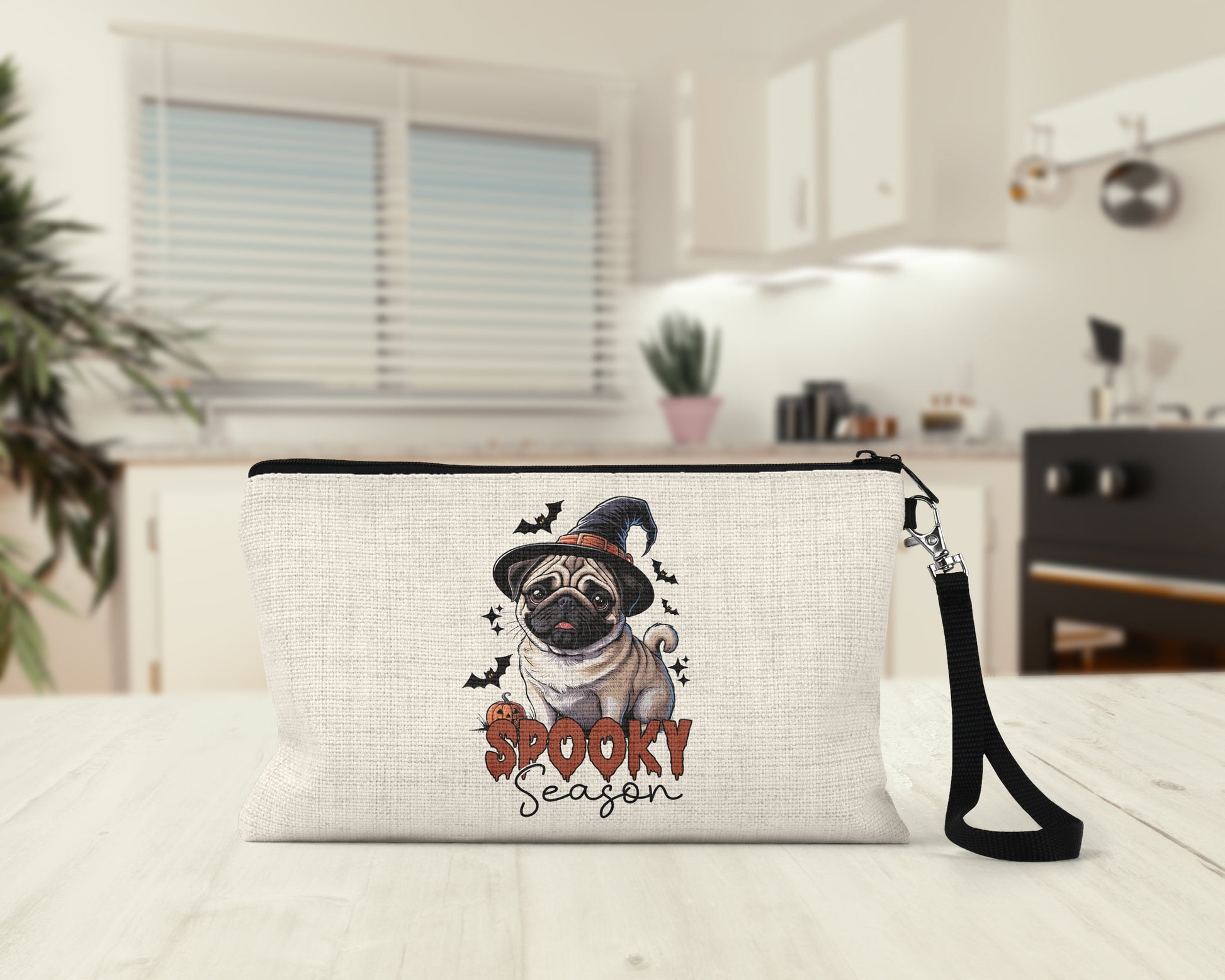 Spooky Season Pug Makeup Bag on a kitchen counter
